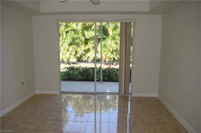 2350 Hidden Lake Ct, #8513, Naples, FL 34112 Unfurnished room featuring light tile patterned floors and a ceiling fan