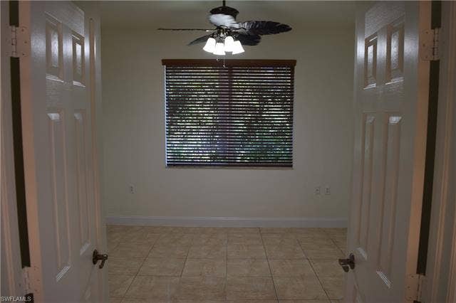 2350 Hidden Lake Ct, #8513, Naples, FL 34112 Unfurnished room with ceiling fan and light tile patterned floors