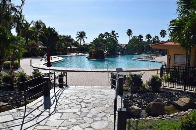 2350 Hidden Lake Ct, #8513, Naples, FL 34112 Community pool with a patio area and a gazebo