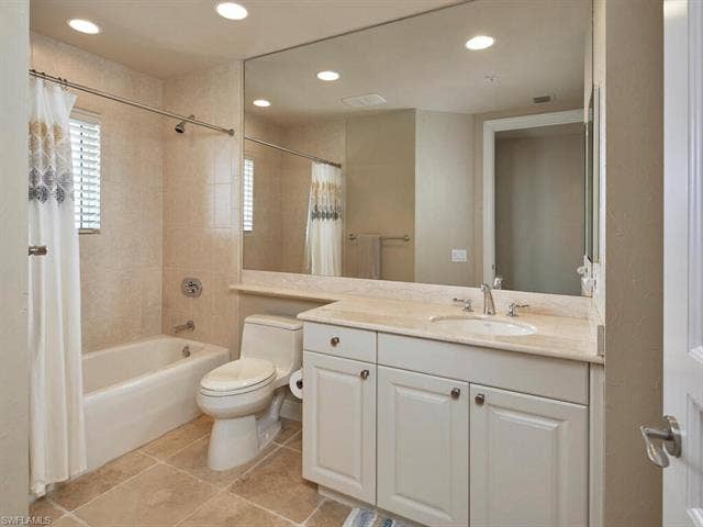 23750 Via Trevi Way, #2001, Estero, FL 34134 Bathroom with light tile patterned floors, shower / bathtub combination with curtain, vanity, and recessed lighting