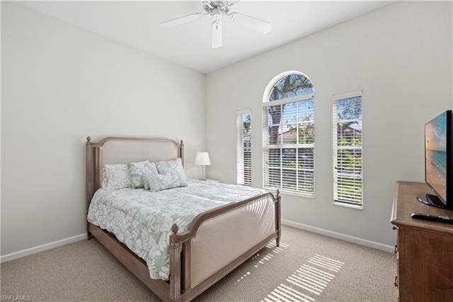 14546 Speranza Way, Bonita Springs, FL 34135 Bedroom featuring a ceiling fan and carpet flooring