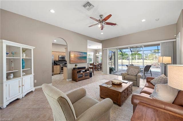 14546 Speranza Way, Bonita Springs, FL 34135 Living area featuring light tile patterned floors, a ceiling fan, a sunroom, and recessed lighting