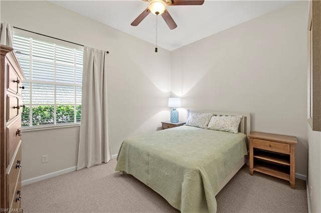 14546 Speranza Way, Bonita Springs, FL 34135 Bedroom featuring a ceiling fan and carpet