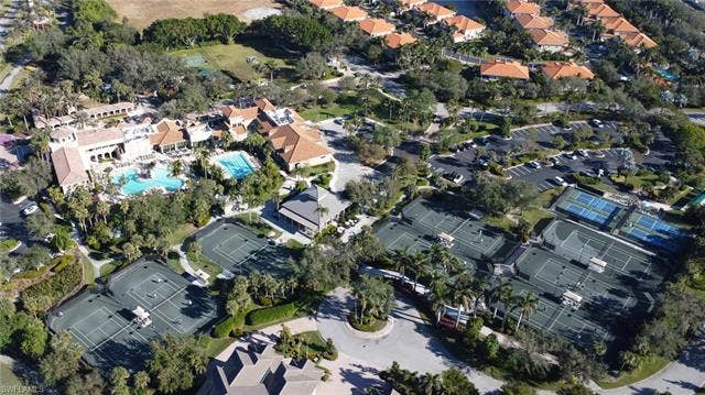 14546 Speranza Way, Bonita Springs, FL 34135 Aerial view of property and surrounding area featuring nearby suburban area and a pool