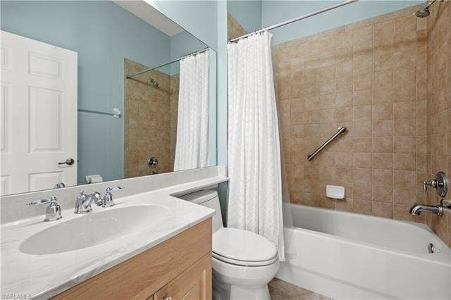 14546 Speranza Way, Bonita Springs, FL 34135 Full bathroom with vanity and shower / bath combination with curtain