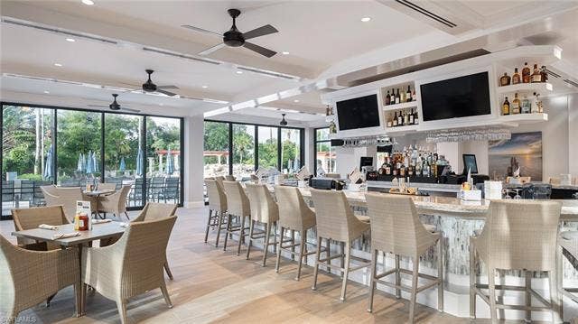 14546 Speranza Way, Bonita Springs, FL 34135 Bar area featuring a ceiling fan and beam ceiling