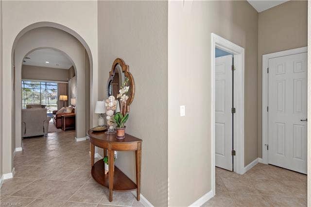 14546 Speranza Way, Bonita Springs, FL 34135 Hall featuring arched walkways and light tile patterned flooring