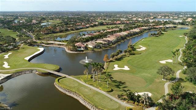 14546 Speranza Way, Bonita Springs, FL 34135 Aerial overview of property's location featuring a golf course and nearby suburban area