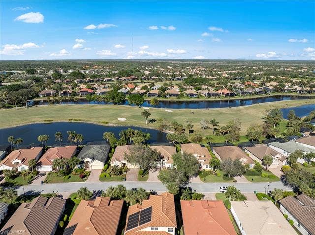 14546 Speranza Way, Bonita Springs, FL 34135 Aerial perspective of suburban area featuring a nearby body of water and a golf club