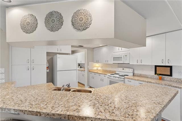 13201 Bridgeford Ave, Bonita Springs, FL 34135 Right of refrigerator is laundry room and entrance to garage