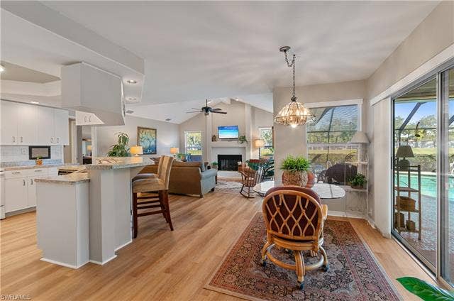 13201 Bridgeford Ave, Bonita Springs, FL 34135 As you walk in from living room you are greeted with a large kitchen and family room with plenty of natural lighting