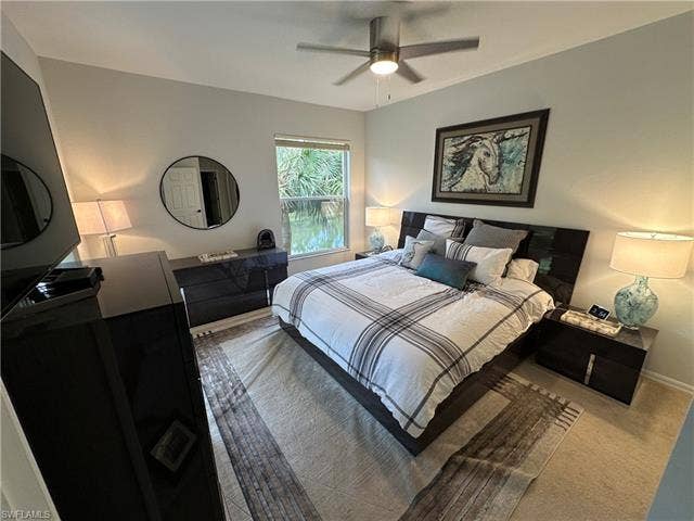 23007 Lone Oak Dr, Estero, FL 33928 Carpeted bedroom with a ceiling fan