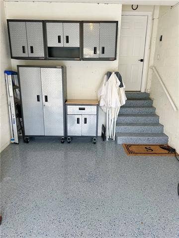 23007 Lone Oak Dr, Estero, FL 33928 Mudroom featuring concrete block wall