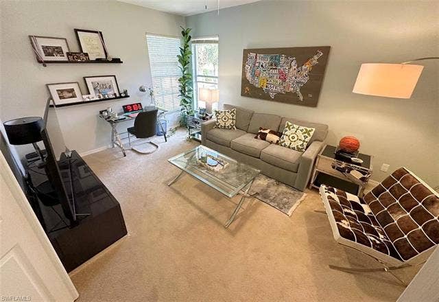 23007 Lone Oak Dr, Estero, FL 33928 Living room with carpet and an office area