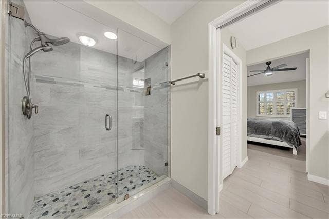 7320 Glenmoor Ln, #2304, Naples, FL 34104 Ensuite bathroom featuring a shower stall and a ceiling fan