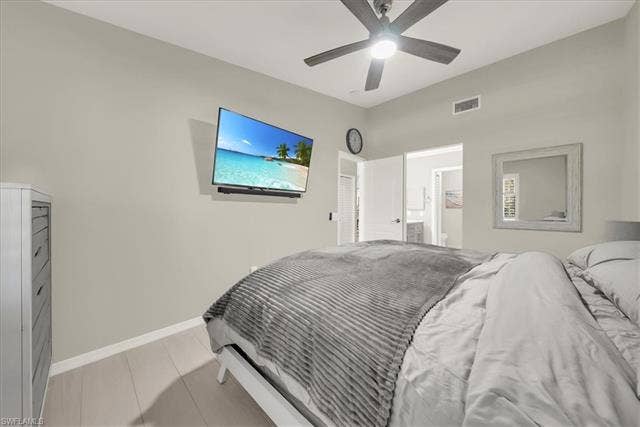 7320 Glenmoor Ln, #2304, Naples, FL 34104 Bedroom featuring a ceiling fan and connected bathroom
