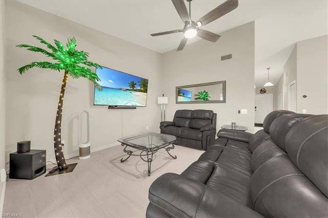 7320 Glenmoor Ln, #2304, Naples, FL 34104 Living area featuring ceiling fan and high vaulted ceiling