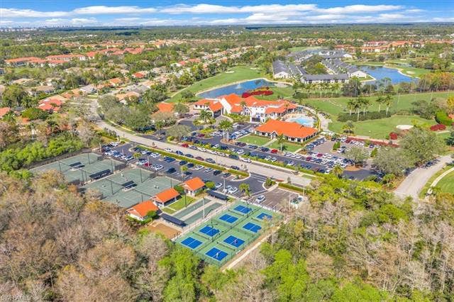 7320 Glenmoor Ln, #2304, Naples, FL 34104 Aerial view of residential area with a large body of water and a golf course