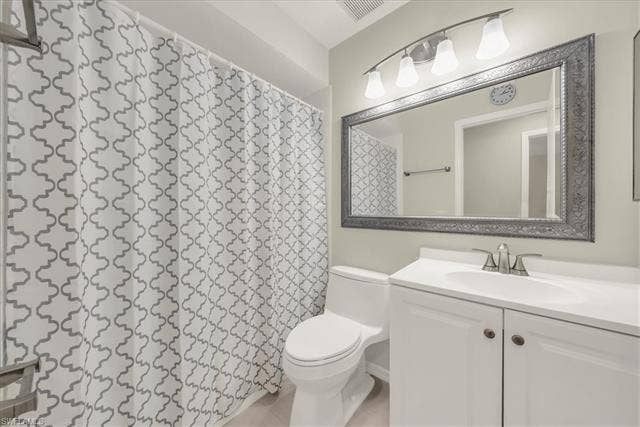 7320 Glenmoor Ln, #2304, Naples, FL 34104 Bathroom featuring vanity and a shower with shower curtain