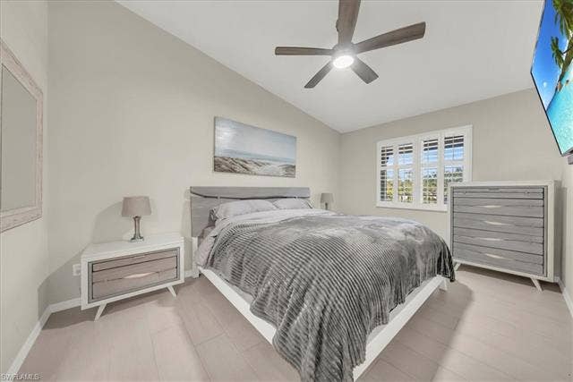 7320 Glenmoor Ln, #2304, Naples, FL 34104 Bedroom with vaulted ceiling and a ceiling fan