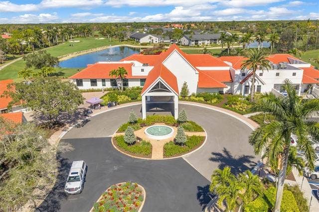 7320 Glenmoor Ln, #2304, Naples, FL 34104 Drone / aerial view of a large body of water and a local golf course