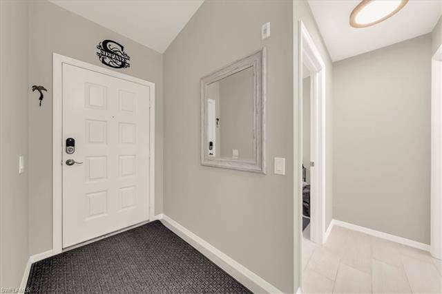 7320 Glenmoor Ln, #2304, Naples, FL 34104 Entrance foyer featuring baseboards and light carpet