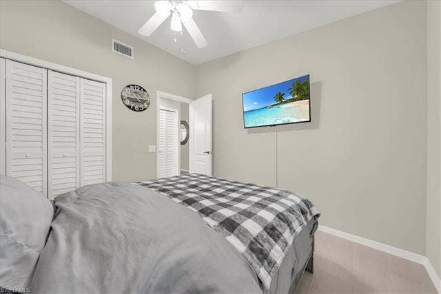 7320 Glenmoor Ln, #2304, Naples, FL 34104 Bedroom with a closet and a ceiling fan