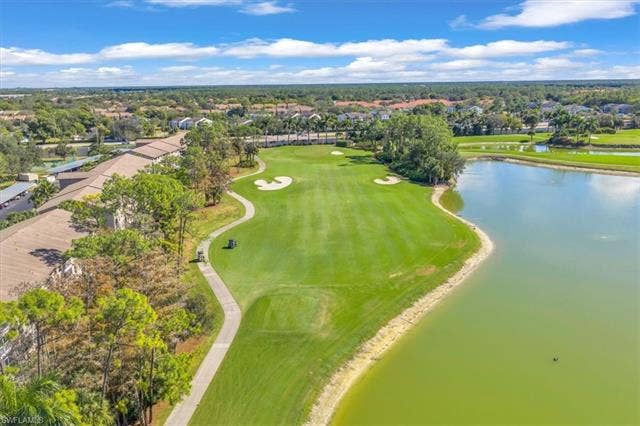 7320 Glenmoor Ln, #2304, Naples, FL 34104 Aerial perspective of suburban area with a large body of water and a golf club