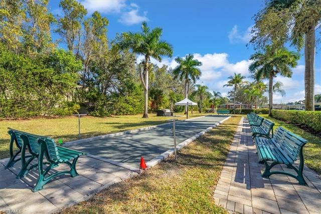 7320 Glenmoor Ln, #2304, Naples, FL 34104 View of home's community with a yard and a game area