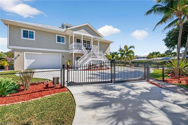 27310 Patrick St, Bonita Springs, FL 34135 Front stairway has newer trex stairway