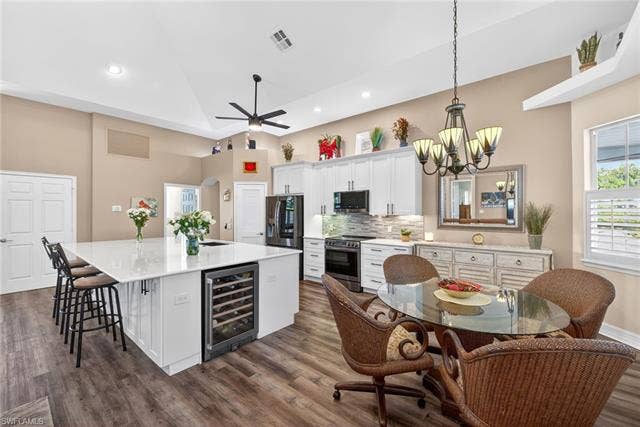 27310 Patrick St, Bonita Springs, FL 34135 Kitchen cabinets and under island has slow close drawer and cabinets with pull out shelving
