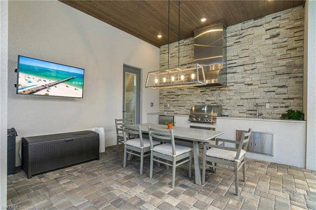 18500 Wildblue Blvd, Fort Myers, FL 33928 Dining room with wood ceiling and recessed lighting