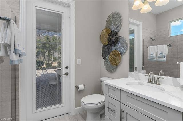 18500 Wildblue Blvd, Fort Myers, FL 33928 Bathroom with a tile shower and vanity