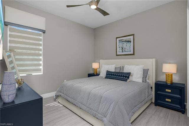 18500 Wildblue Blvd, Fort Myers, FL 33928 Bedroom featuring ceiling fan and light wood-style floors