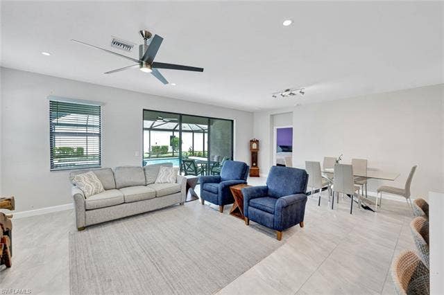 18298 Ridgeline Dr, Estero, FL 33928 Living area featuring a sunroom, ceiling fan, and recessed lighting