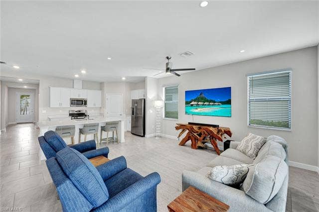 18298 Ridgeline Dr, Estero, FL 33928 Living room featuring recessed lighting and ceiling fan