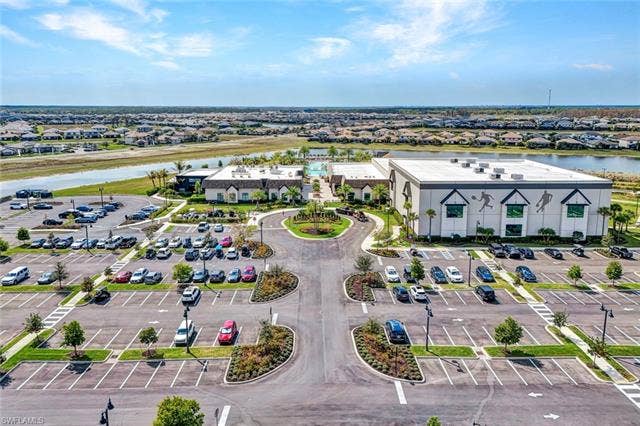 18298 Ridgeline Dr, Estero, FL 33928 Aerial perspective of suburban area featuring a large body of water