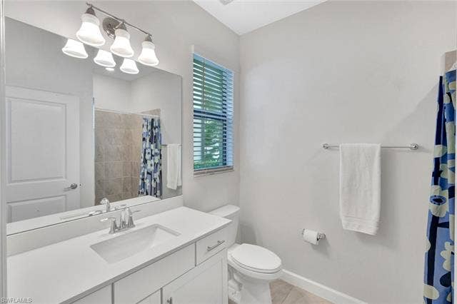 18298 Ridgeline Dr, Estero, FL 33928 Bathroom featuring vanity and a shower with shower curtain