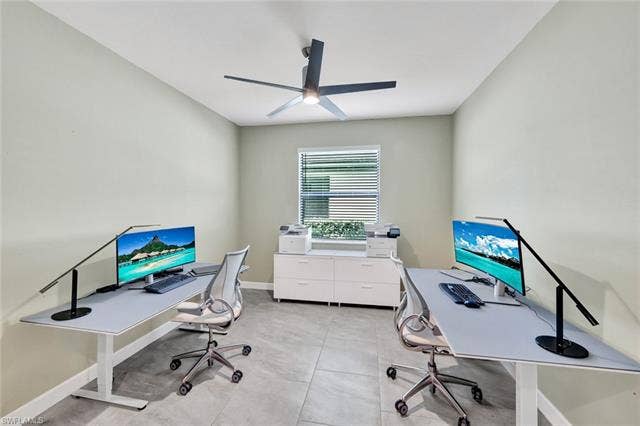 18298 Ridgeline Dr, Estero, FL 33928 Home office with a ceiling fan and baseboards