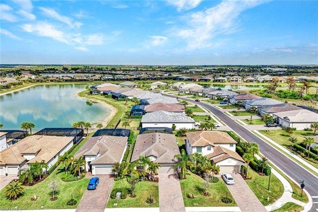 18298 Ridgeline Dr, Estero, FL 33928 Aerial perspective of suburban area featuring a large body of water