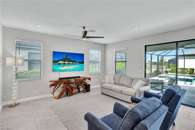 18298 Ridgeline Dr, Estero, FL 33928 Living area with a ceiling fan, a sunroom, and recessed lighting