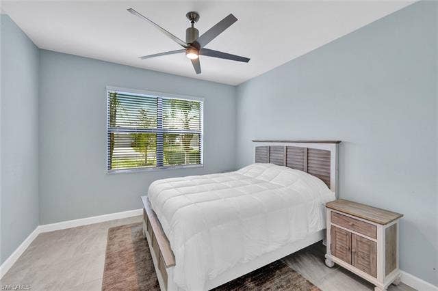 18298 Ridgeline Dr, Estero, FL 33928 Bedroom featuring baseboards and ceiling fan
