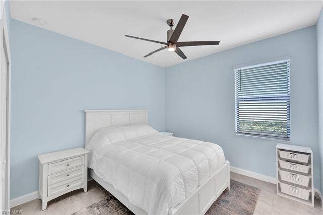18298 Ridgeline Dr, Estero, FL 33928 Bedroom with baseboards and a ceiling fan