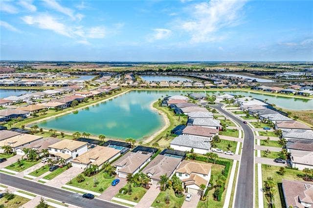 18298 Ridgeline Dr, Estero, FL 33928 Aerial view of residential area with a large body of water