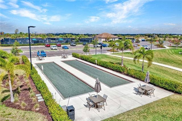 18298 Ridgeline Dr, Estero, FL 33928 View of property's community featuring a bocce ball area and a patio area
