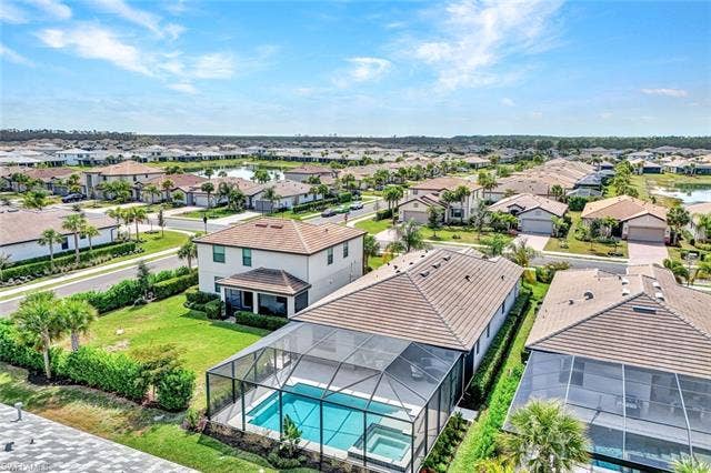 18298 Ridgeline Dr, Estero, FL 33928 Aerial view of residential area featuring a pool area