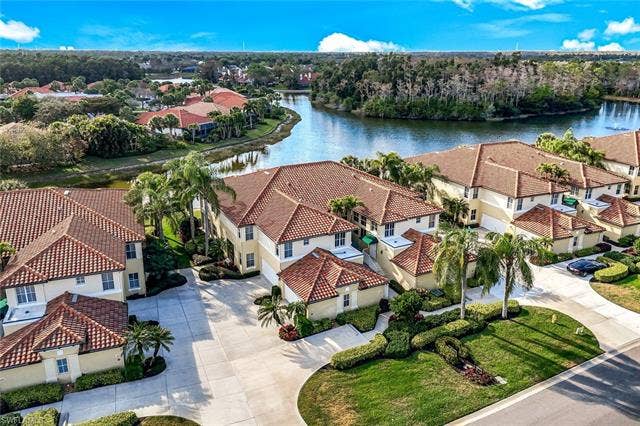 20667 Wildcat Run Dr, #101, Estero, FL 33928 Aerial view of residential area with a nearby body of water