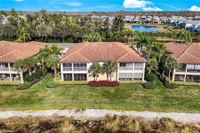 20667 Wildcat Run Dr, #101, Estero, FL 33928 Aerial view of residential area with a large body of water