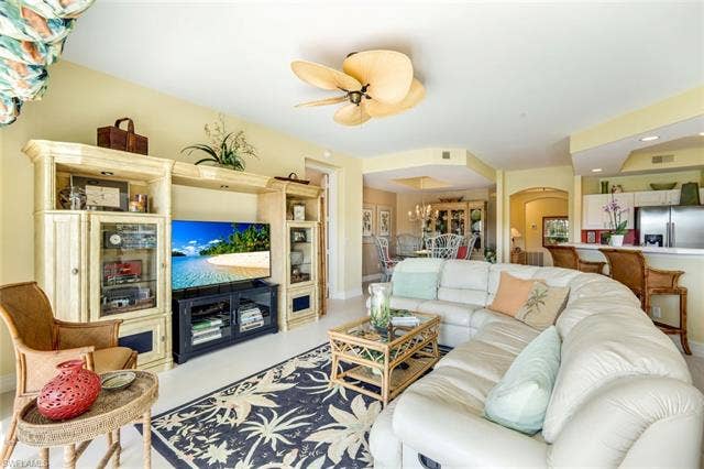 20667 Wildcat Run Dr, #101, Estero, FL 33928 Living room featuring recessed lighting, ceiling fan, and arched walkways