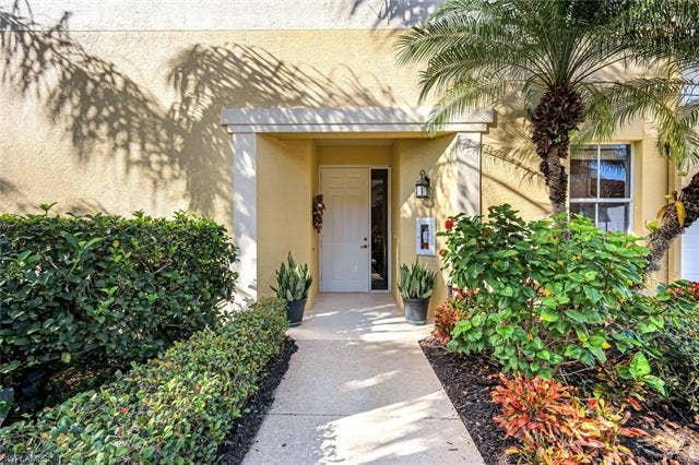 20667 Wildcat Run Dr, #101, Estero, FL 33928 Entrance to property with stucco siding